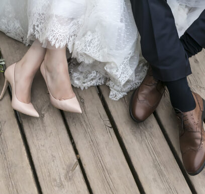 Feet,Of,Bride,And,Groom,,Wedding,Shoes,(soft,Focus).,Cross