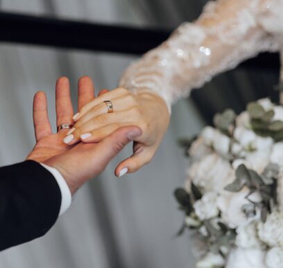 A,Bride,And,Groom,Are,Holding,Hands,,With,The,Bride